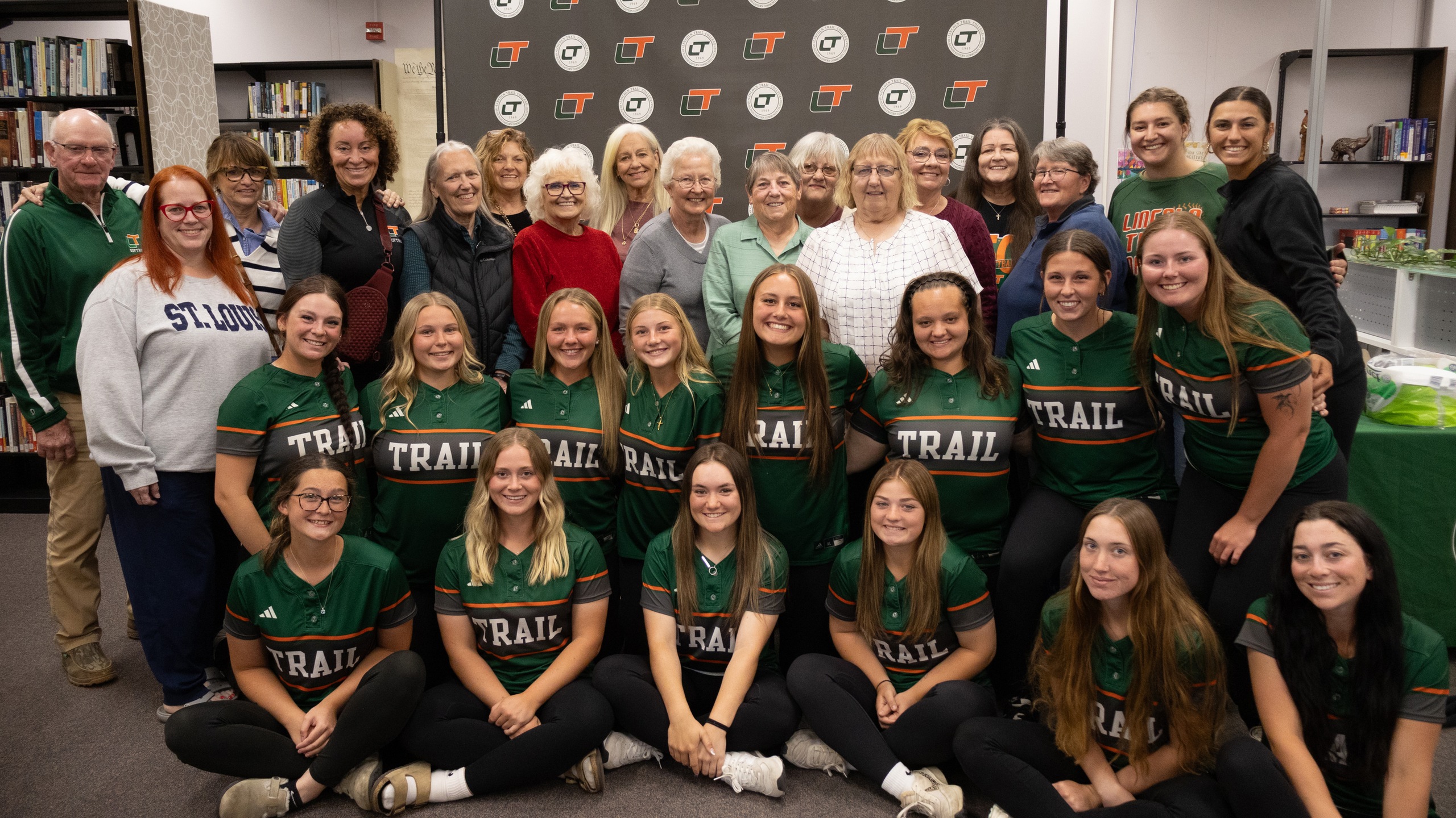 Lincoln Trail College softball alumni and current players pose for a group photo during the college’s Softball Alumni Recognition event celebrating 50 years of LTC softball.
