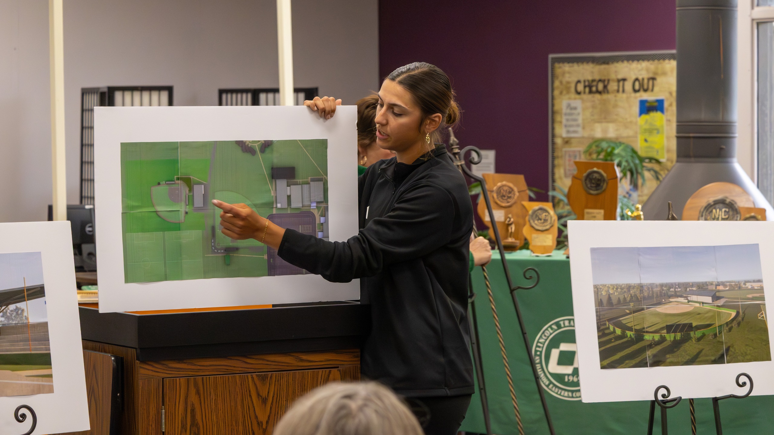 Lincoln Trail College Softball Coach Eva Richardson shares plans and renderings for the college's future on-campus softball complex during the Softball Alumni Recognition event.